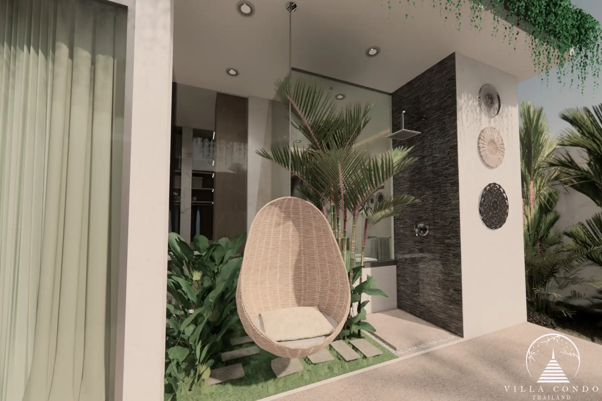 Outdoor area at Unique Villa Kata with a hanging sofa and garden view.
