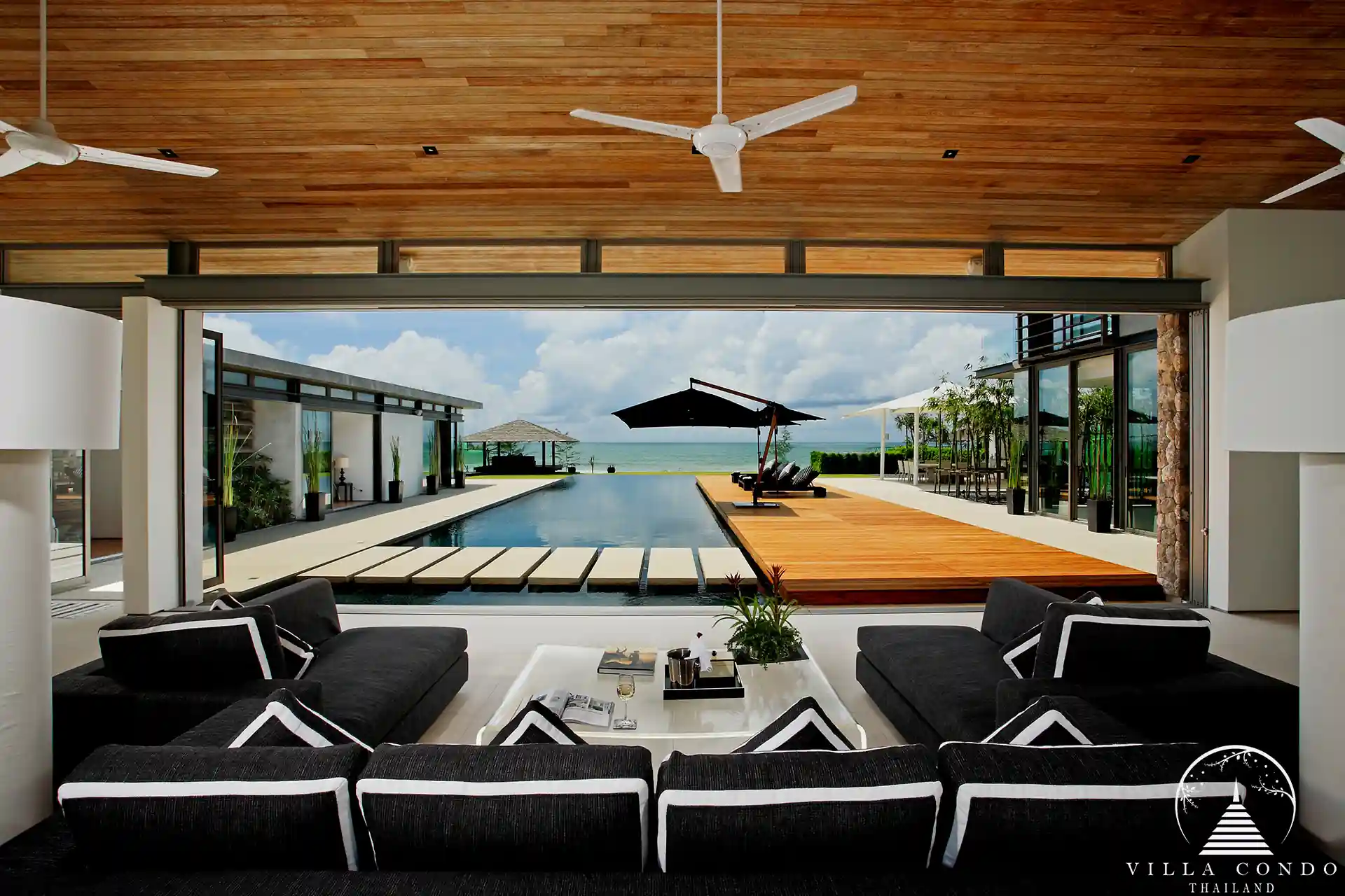 Luxurious interior of Villa Essenza Natai Beach Front with open-plan living space.