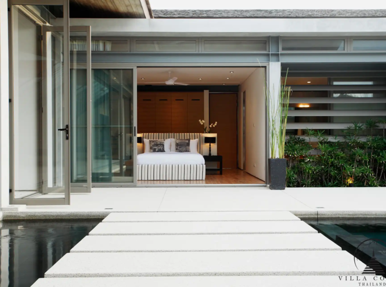 Beautiful outdoor area at Villa Essenza Natai Beach Front with beachfront gazebo and lounge chairs.