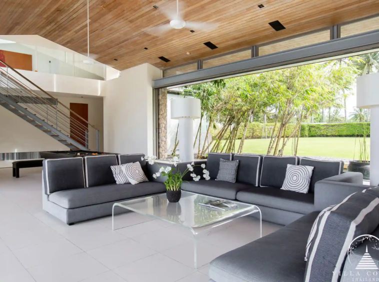 Spacious living area at Villa Essenza Natai Beach Front with pool and sea views.