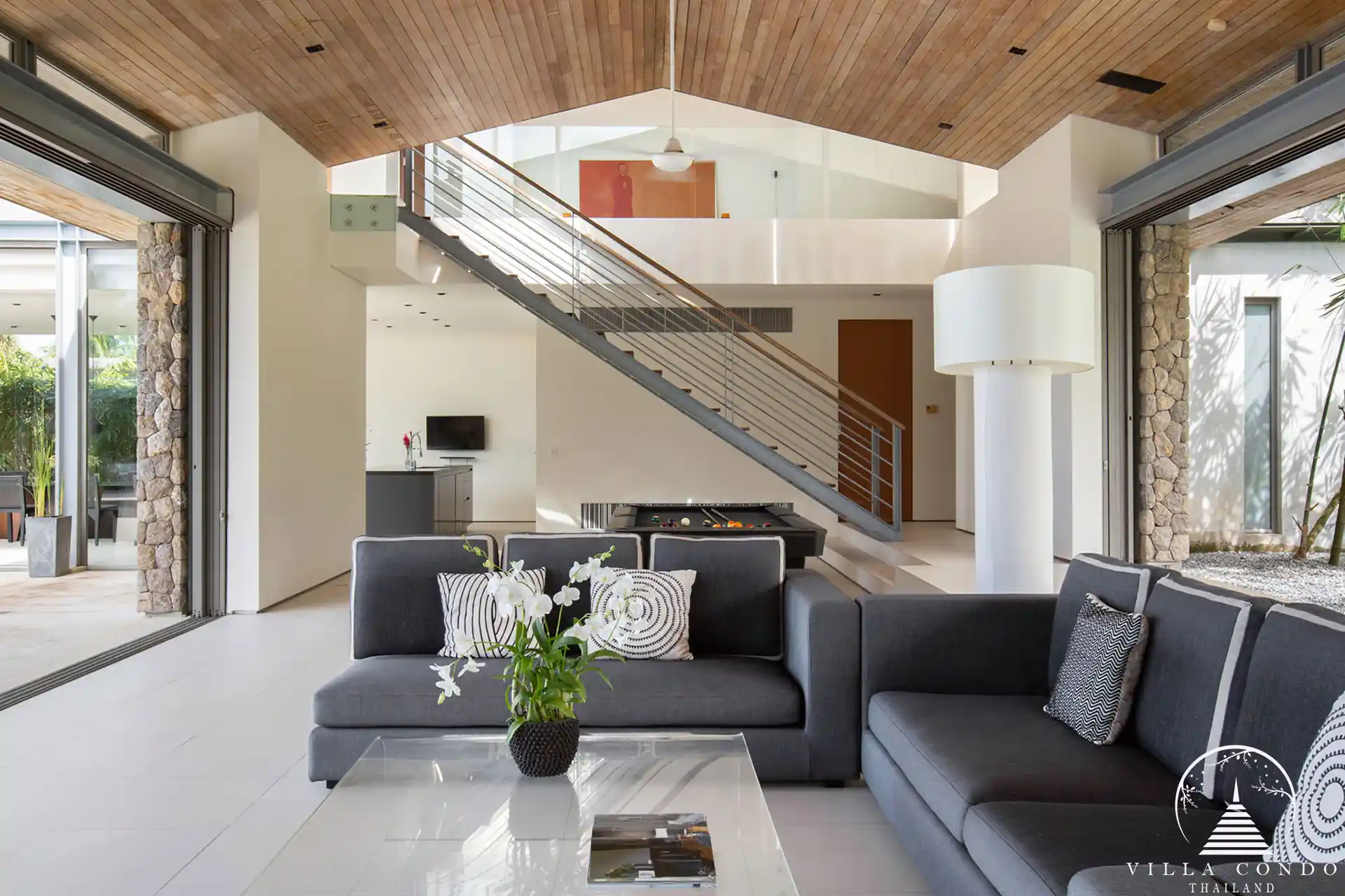 Luxurious interior of Villa Essenza Natai Beach Front with open-plan living space.