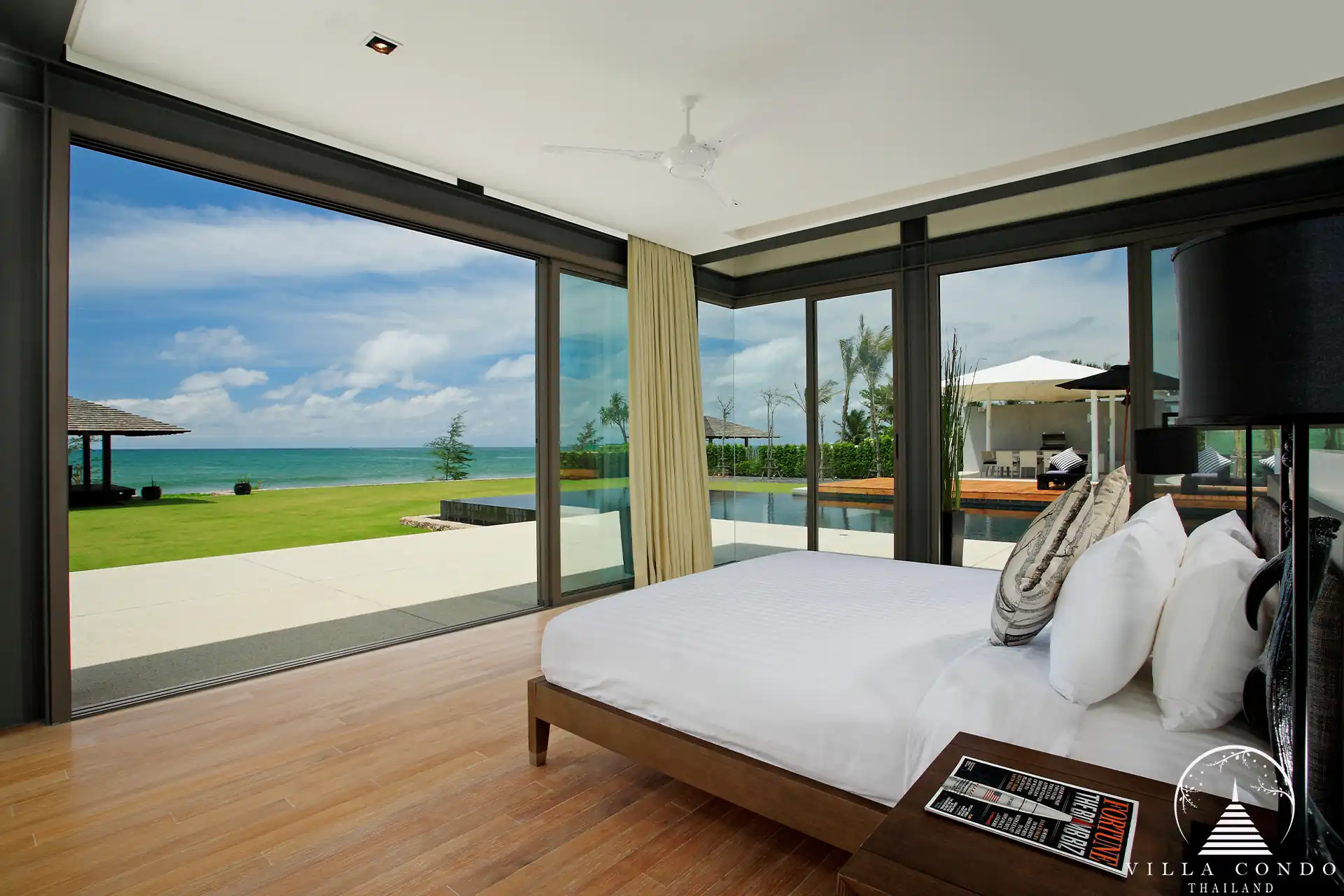 Spacious bedroom in Villa Essenza Natai Beach Front with sea views and stylish décor.