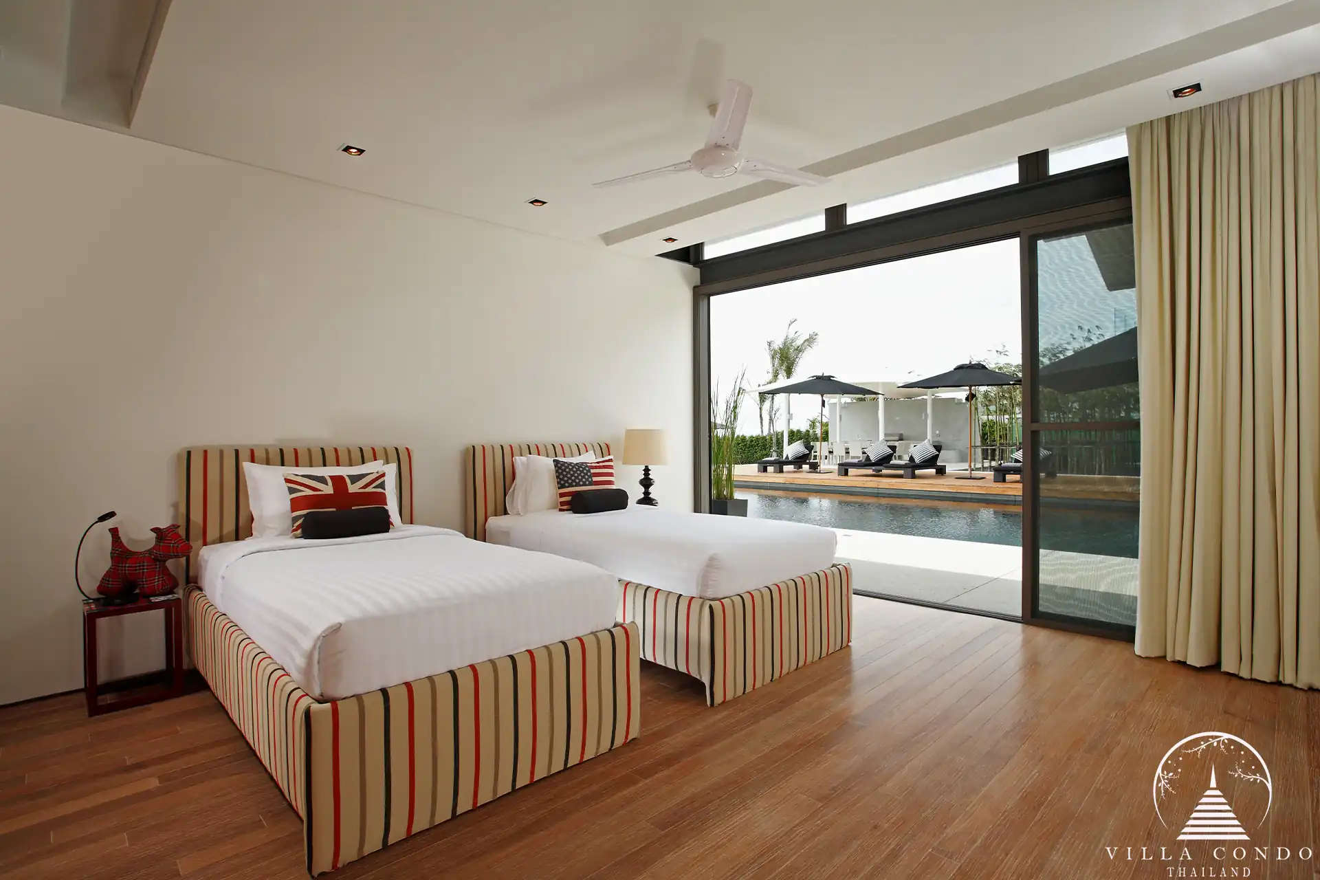 Spacious bedroom in Villa Essenza Natai Beach Front with sea views and stylish décor.
