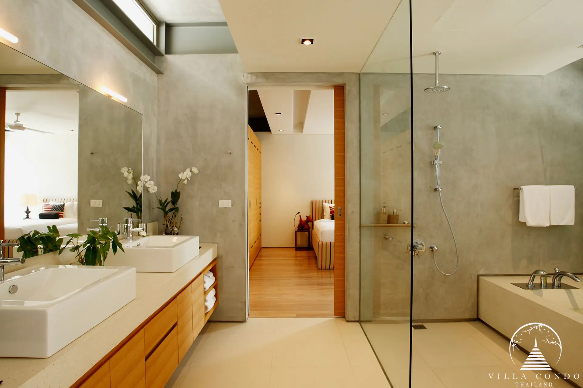 Spacious master bathroom at Villa Essenza Natai Beach Front with luxury finishes and ocean views.