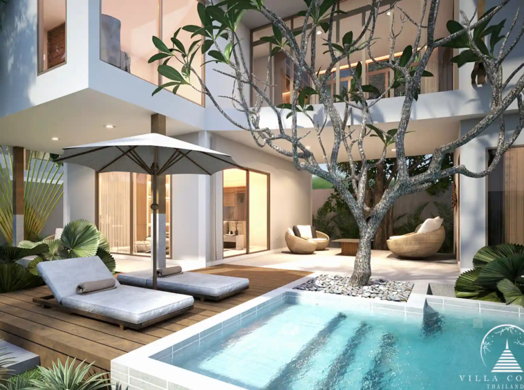 Private pool with sunbeds at Vinzita Elite Residences, surrounded by tropical greenery.