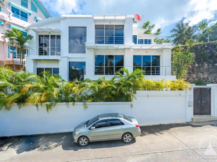 White Villa Patong exterior view with modern architecture and sea views.