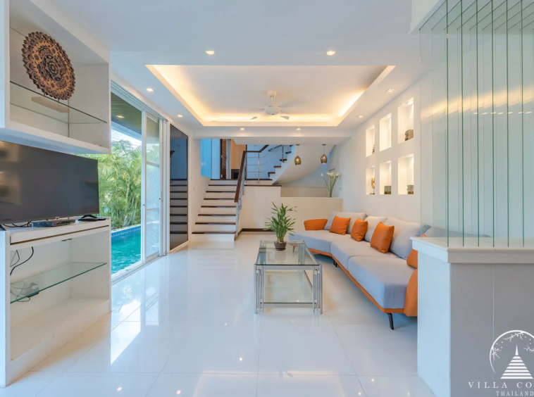 Spacious living area in White Villa Patong with entertainment system and sea view.
