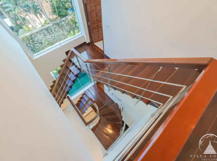 White Villa Patong modern staircase connecting all three levels of the villa.