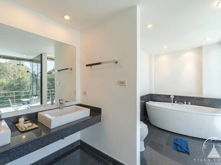 White Villa Patong master bathroom with jacuzzi and panoramic views.