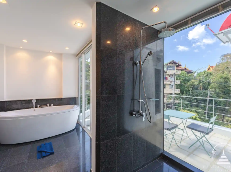 White Villa Patong master bathroom with jacuzzi and panoramic views.