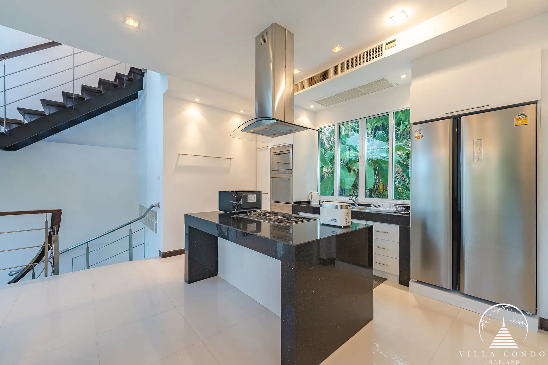 White Villa Patong fully equipped modern kitchen with sea view.