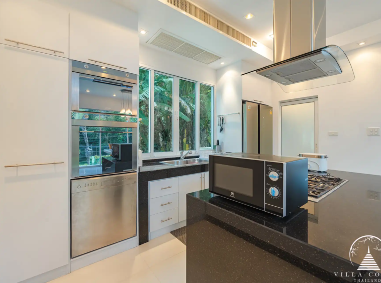 White Villa Patong fully equipped modern kitchen with sea view.