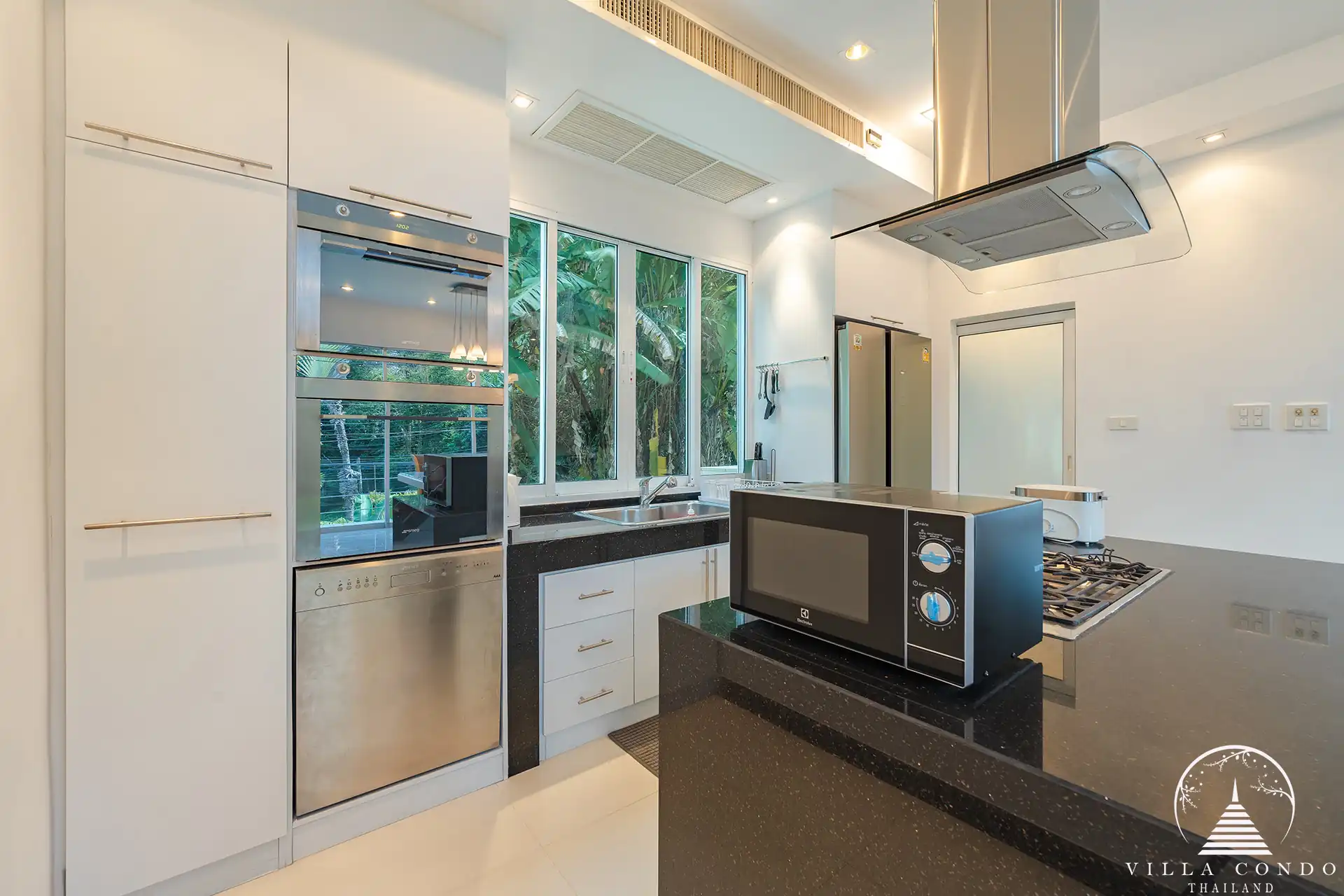White Villa Patong fully equipped modern kitchen with sea view.