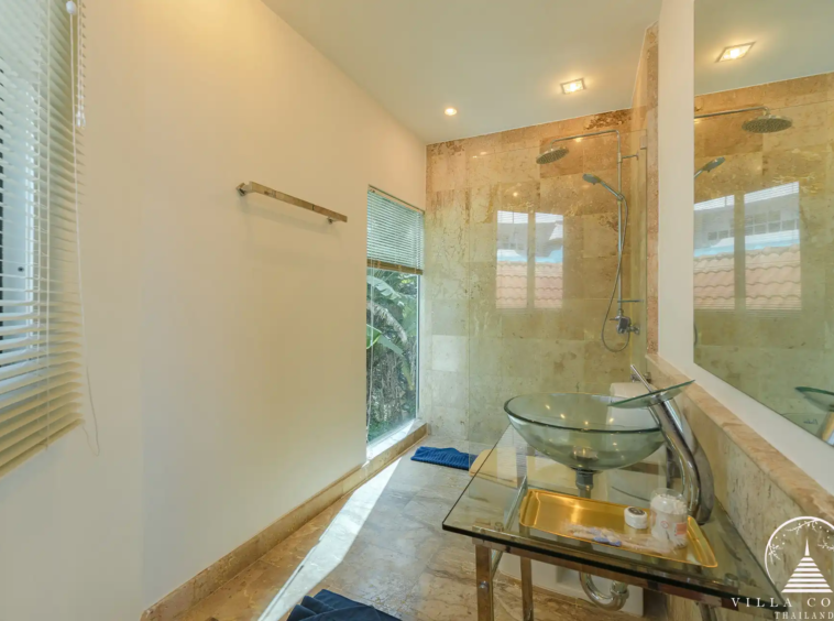 Modern guest bathroom in White Villa Patong with elegant fixtures and spacious design.