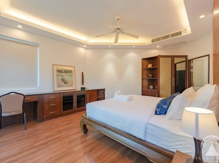 Second bedroom in White Villa Patong with modern décor and private balcony.