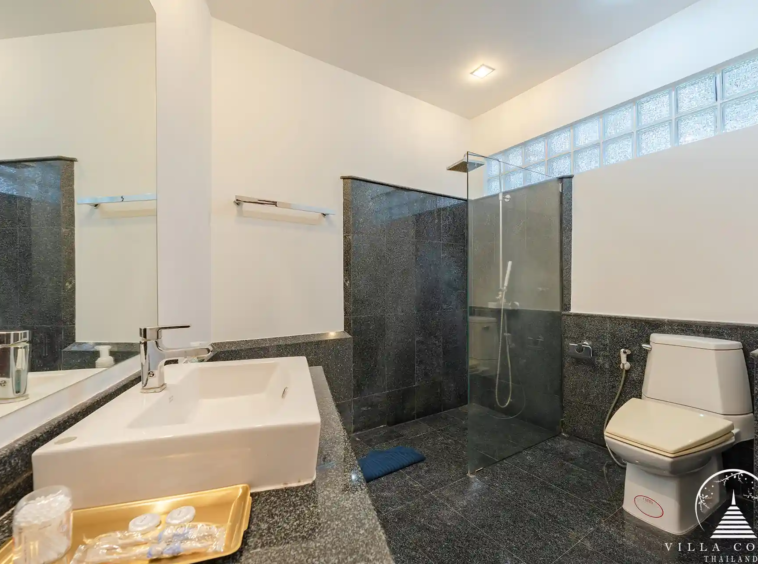 White Villa Patong luxury bathroom with jacuzzi and modern fixtures.