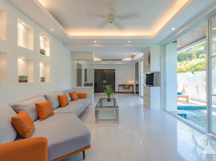 Spacious living area in White Villa Patong with entertainment system and sea view.