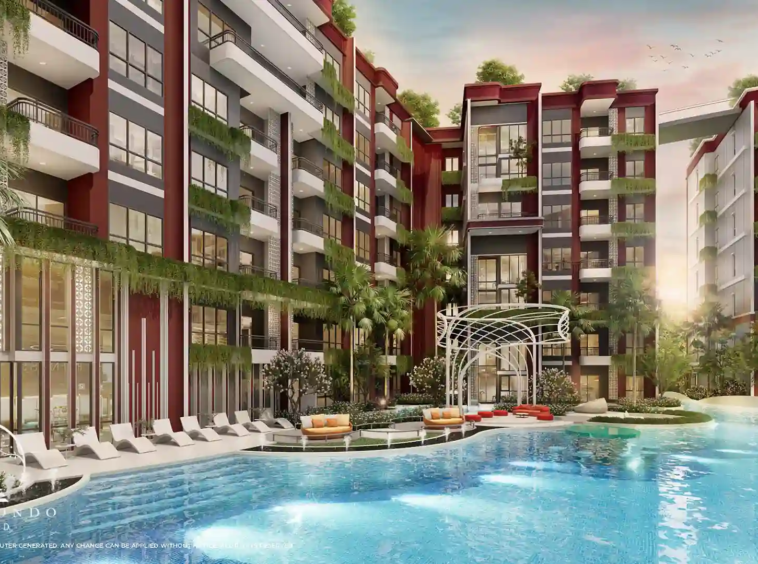 The beautiful swimming pool at The Title Artrio Bangtao surrounded by lush greenery.