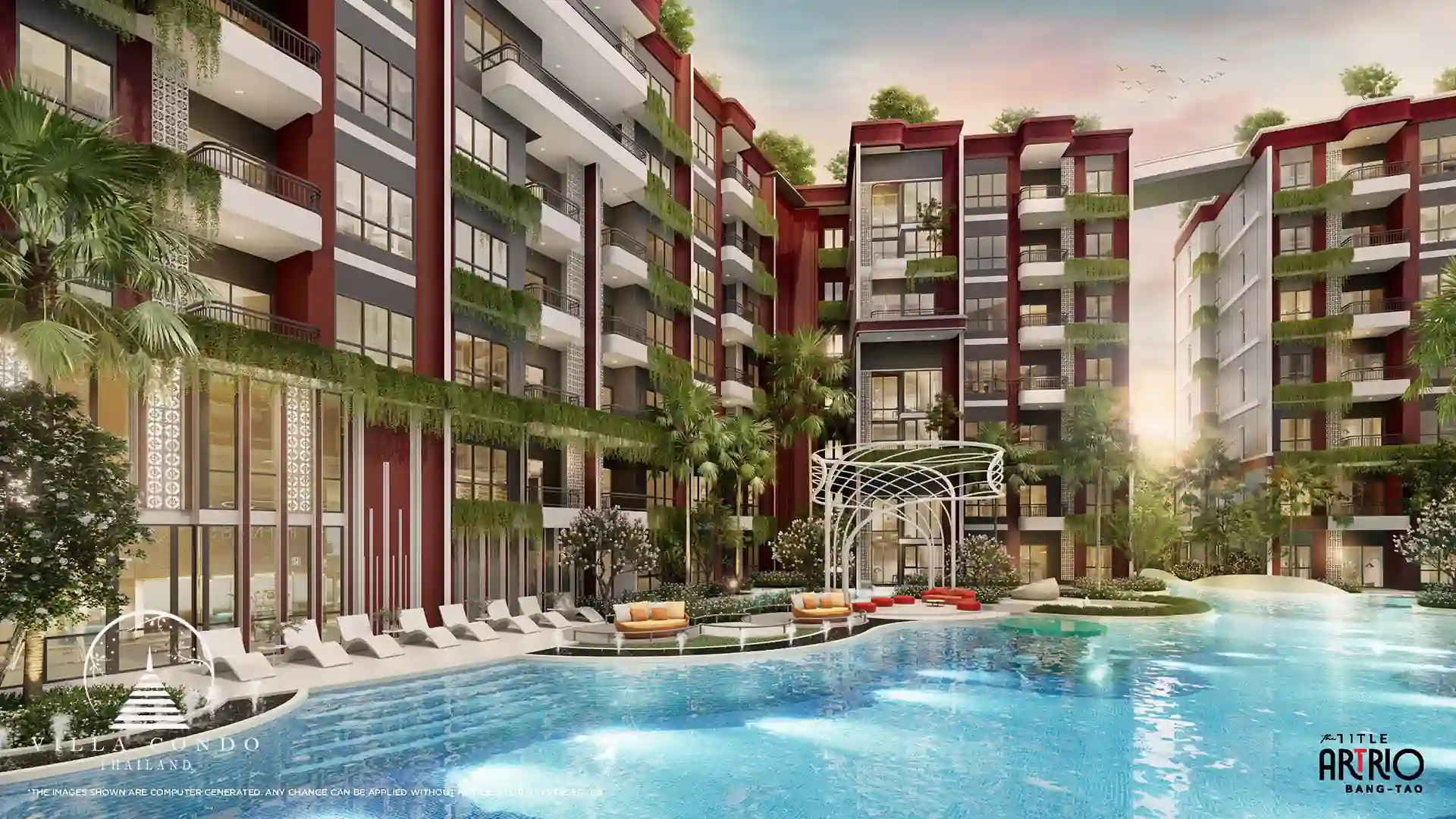 The beautiful swimming pool at The Title Artrio Bangtao surrounded by lush greenery.