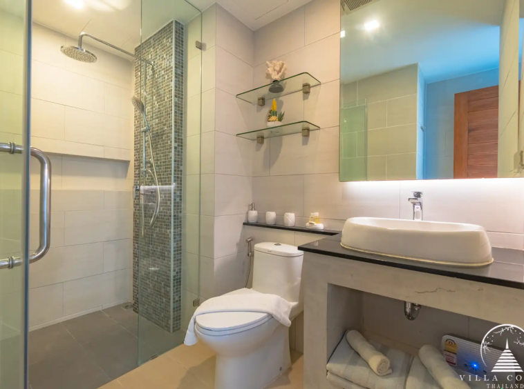 Babylon Sky Garden Phase 2 contemporary bathroom with glass shower in Rawai condo.