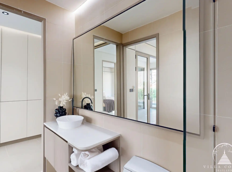 Ever Prime Residences Karon guest bathroom vanity with large mirror