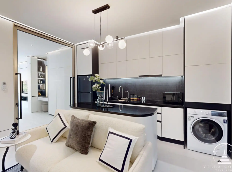 Ever Prime Residences Karon living room with built-in cabinetry and washer