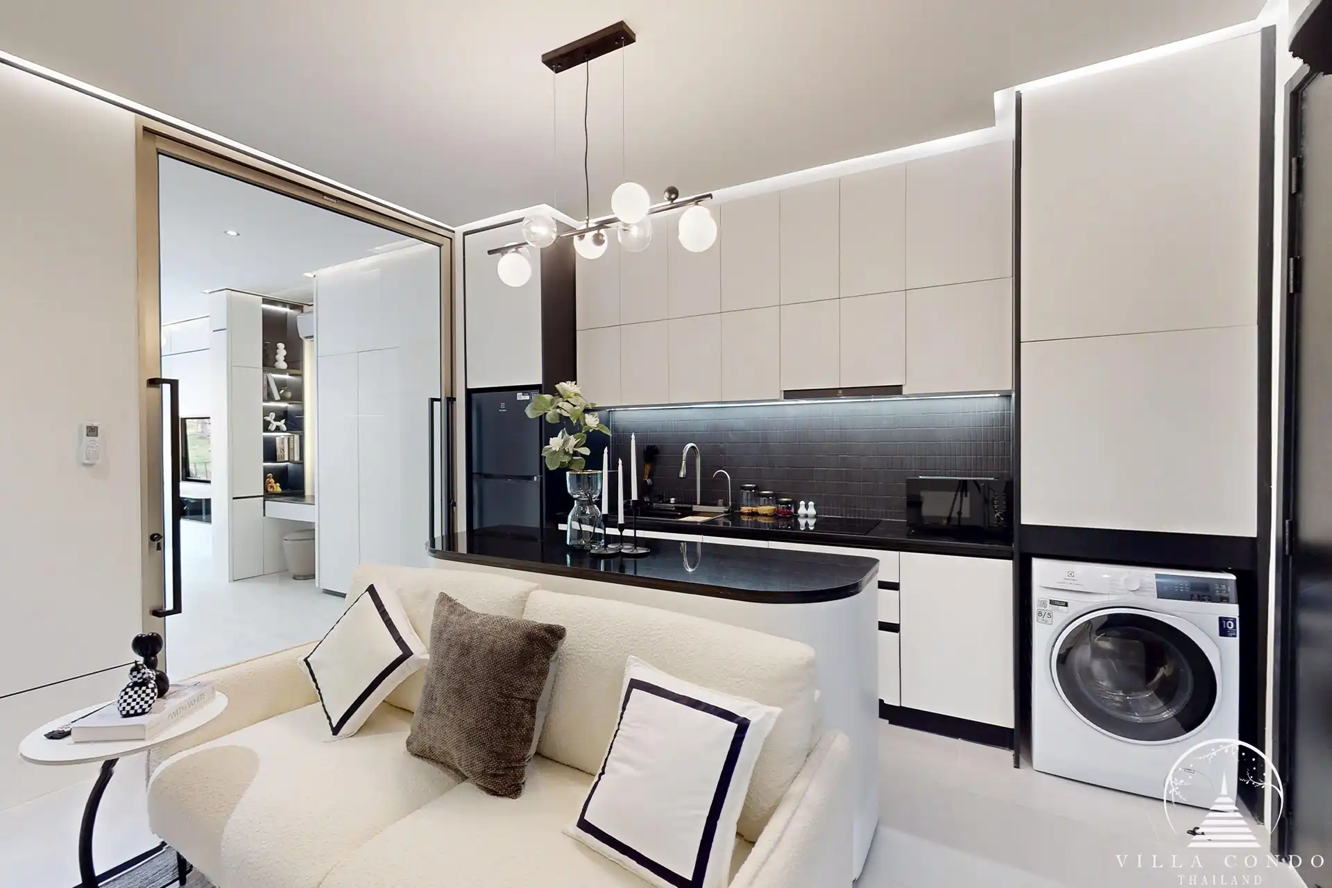 Ever Prime Residences Karon living room with built-in cabinetry and washer