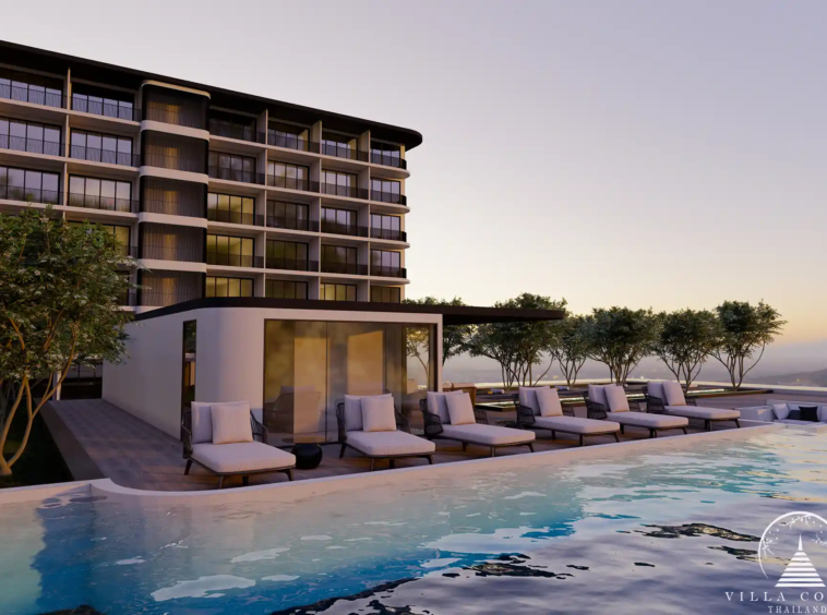 Ever Prime Residences Karon poolside sun deck with loungers at sunset