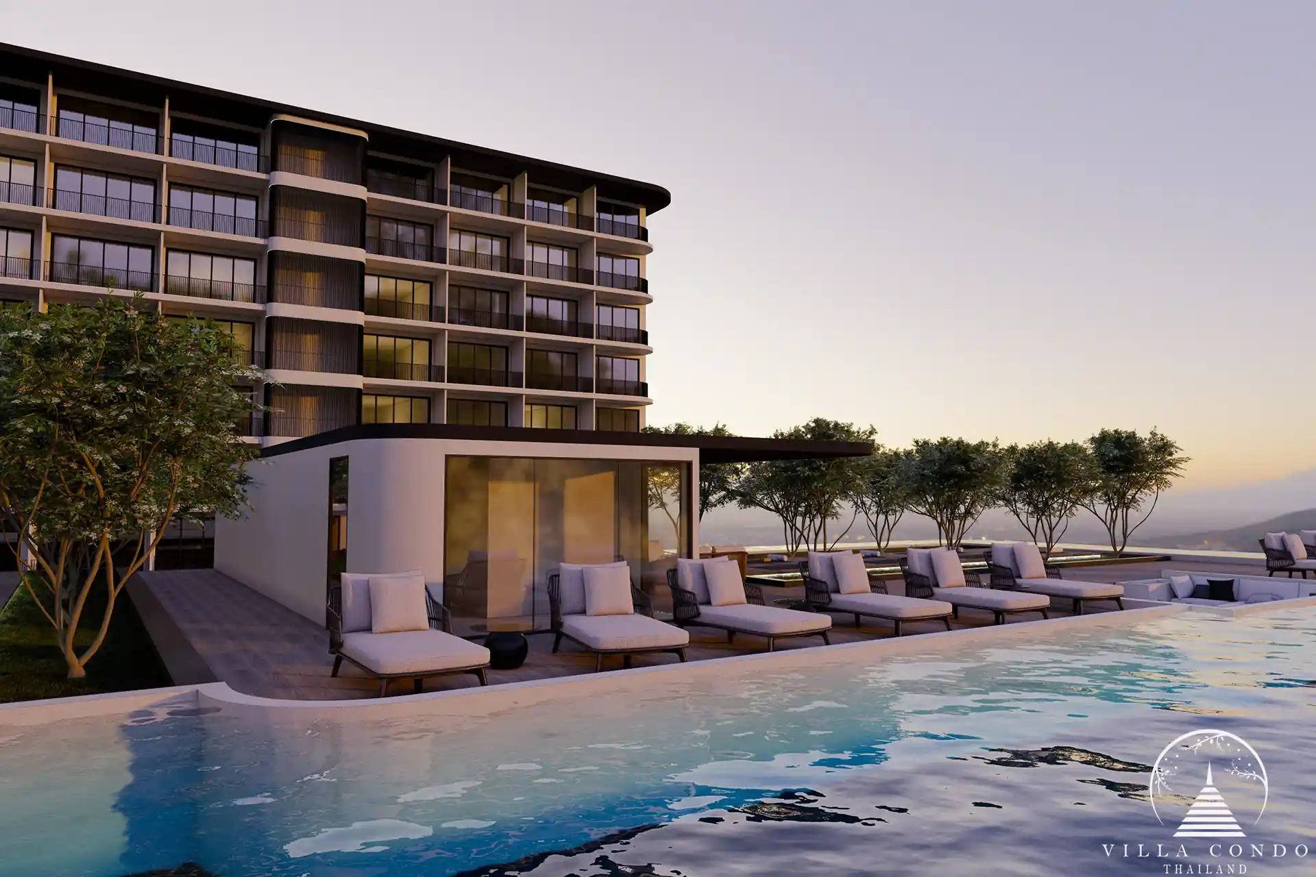Ever Prime Residences Karon poolside sun deck with loungers at sunset