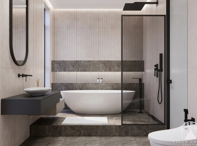 Orbita Villa Town Rawai bathroom with glass shower and bathtub on stone flooring