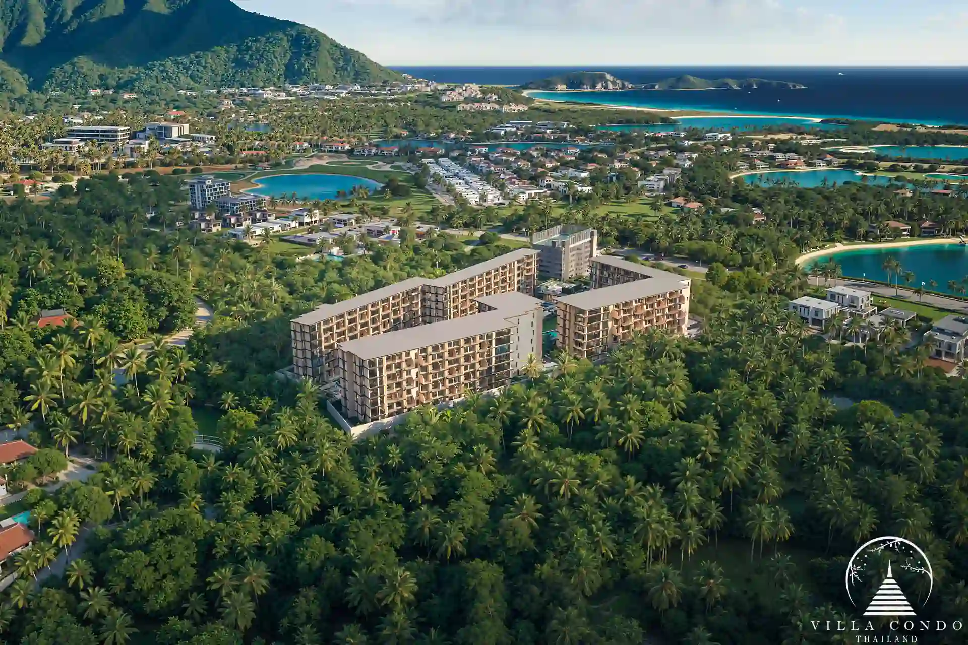 Peylaa Bangtao Beach Condominium aerial view with tropical coastline backdrop