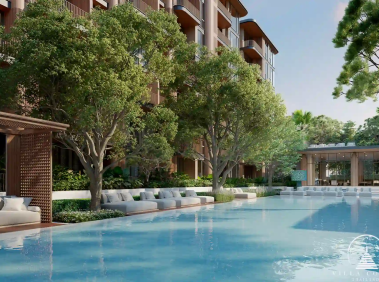 Peylaa Bangtao Beach Condominium luxury poolside with sun loungers in Phuket
