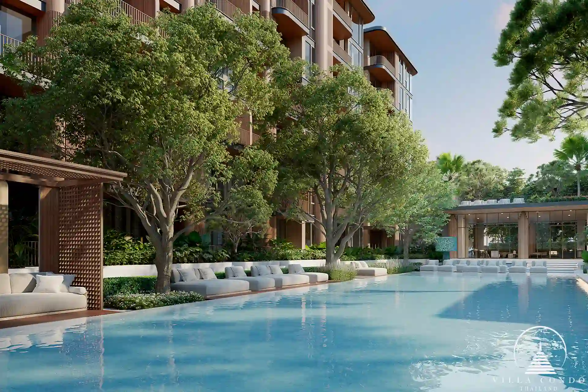 Peylaa Bangtao Beach Condominium luxury poolside with sun loungers in Phuket