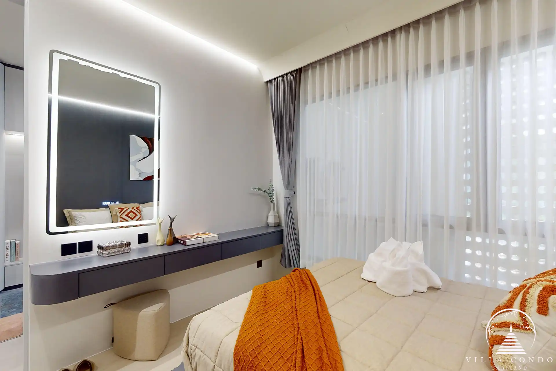 The Element Condo Kamala bedroom with vanity desk and large window view