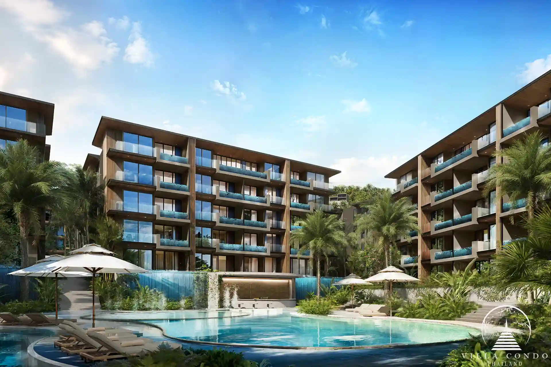 The Forest Patong Condo cascading pool with curved sun shelf and palms