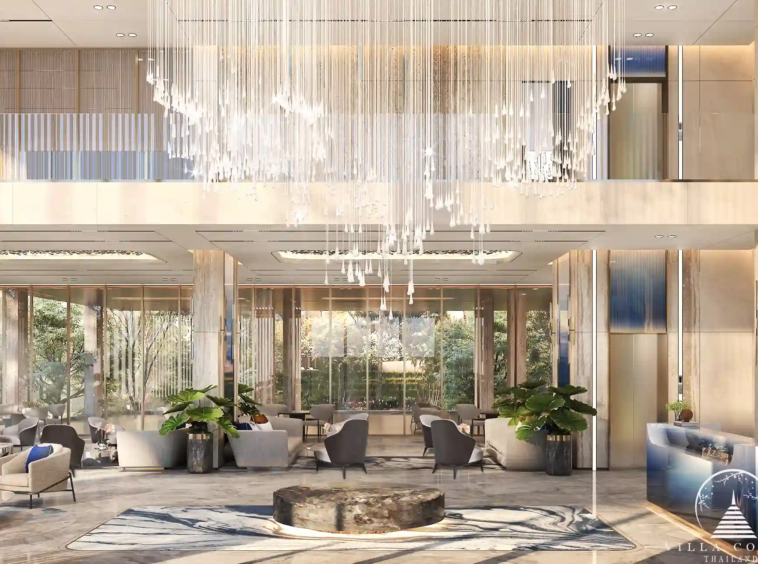 The Forest Patong Condo double-height lobby with crystal chandelier